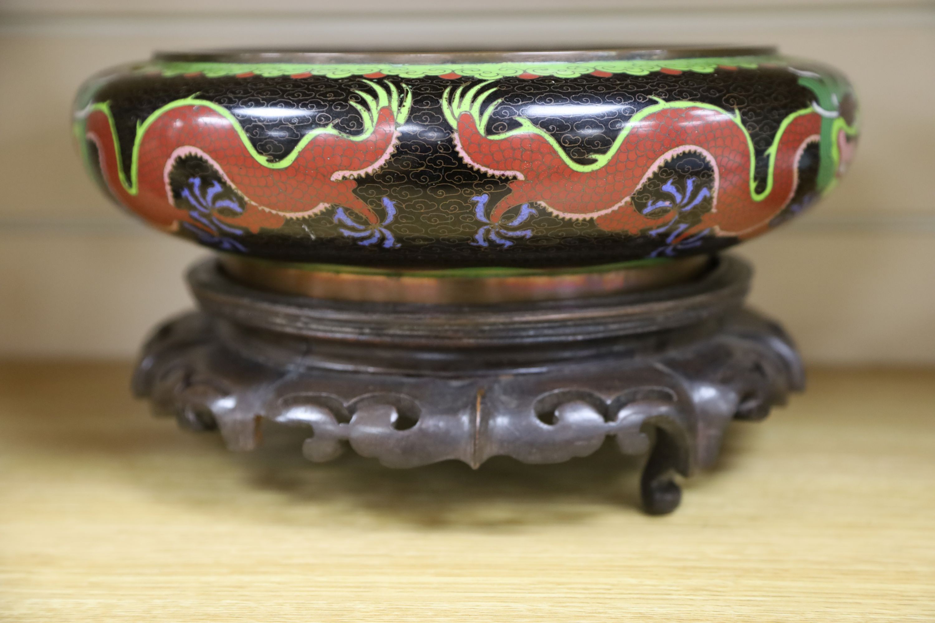 A large early 20th century Chinese cloisonné enamel ‘dragon’ bowl and two Chinese Tongzhi celadon ground famille rose bowls 31cm